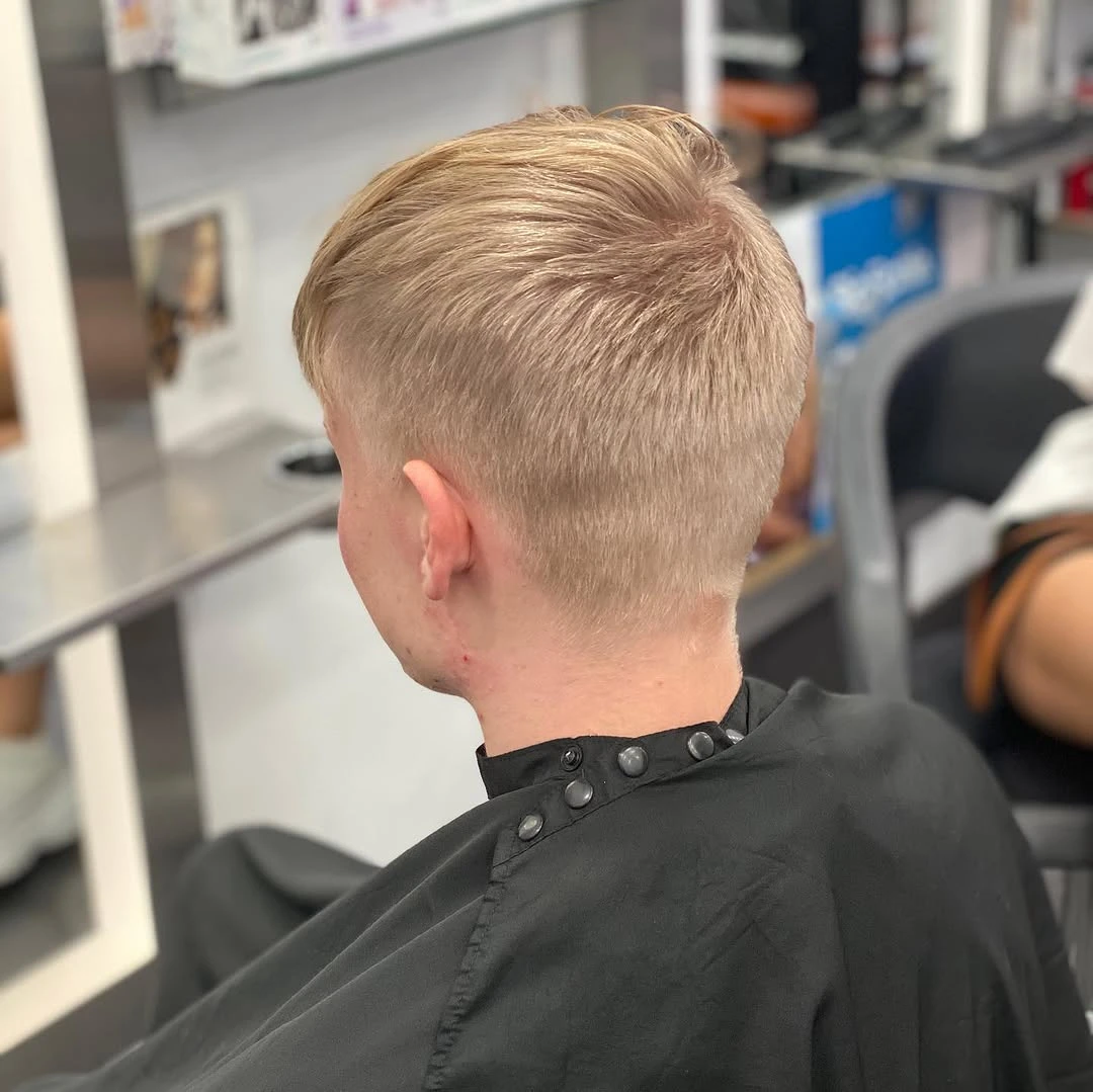 Men's short clipper cut finished at the styling chair, tapered through the back and sides